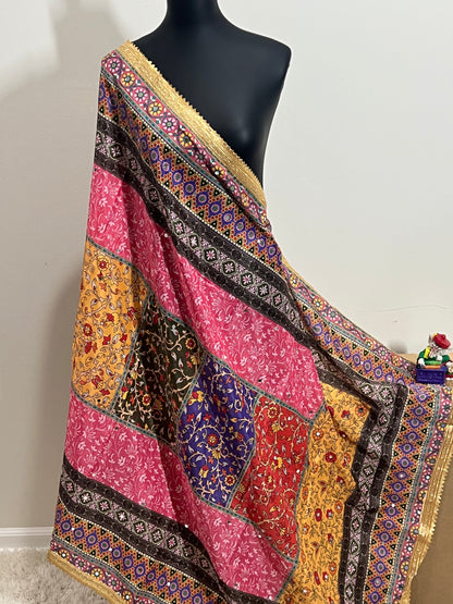 Colorful Malai silk dupatta with patchwork blocks, floral motifs, and gold border draped on a mannequin.