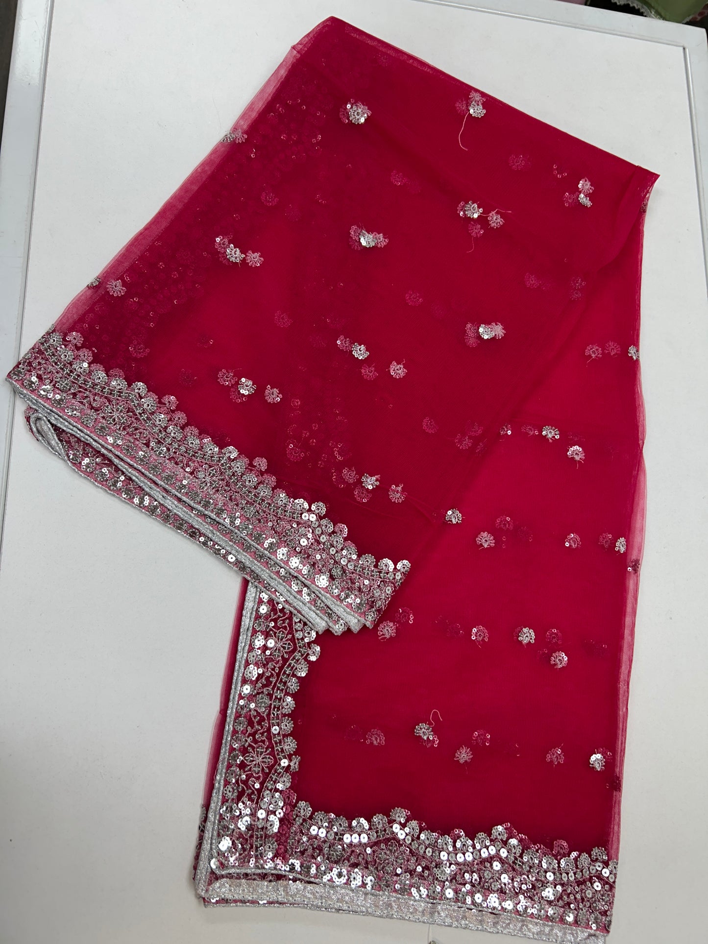 Dark pink net duppata with silver sequence work