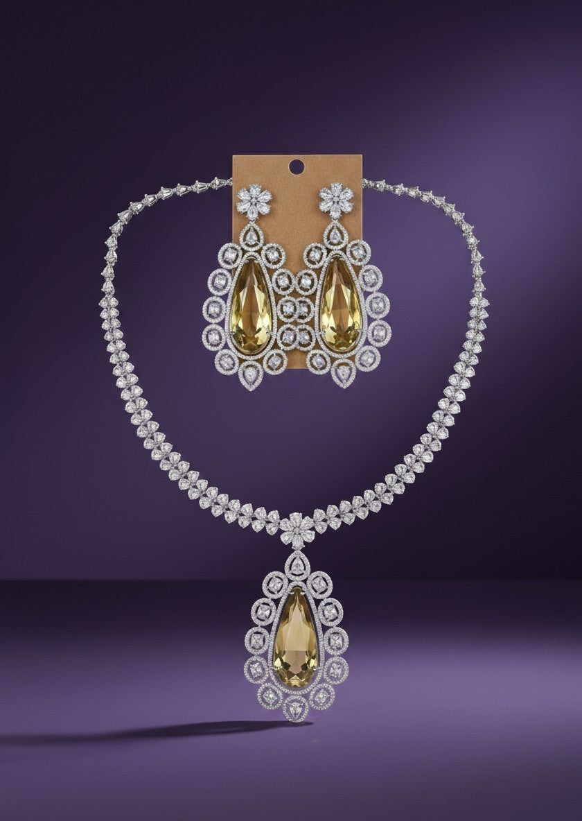 Kurti Connection USA statement necklace and earrings set with large pear-shaped yellow gemstones and clear crystals.