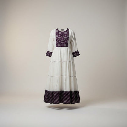 Kurti Connection USA white tiered maxi dress with embroidered purple yoke and cuffs, long sleeves, and a flowing silhouette.
