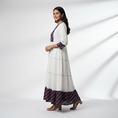 Kurti Connection USA white tiered maxi dress with embroidered purple yoke and cuffs, 3/4 sleeves, and patterned hem.